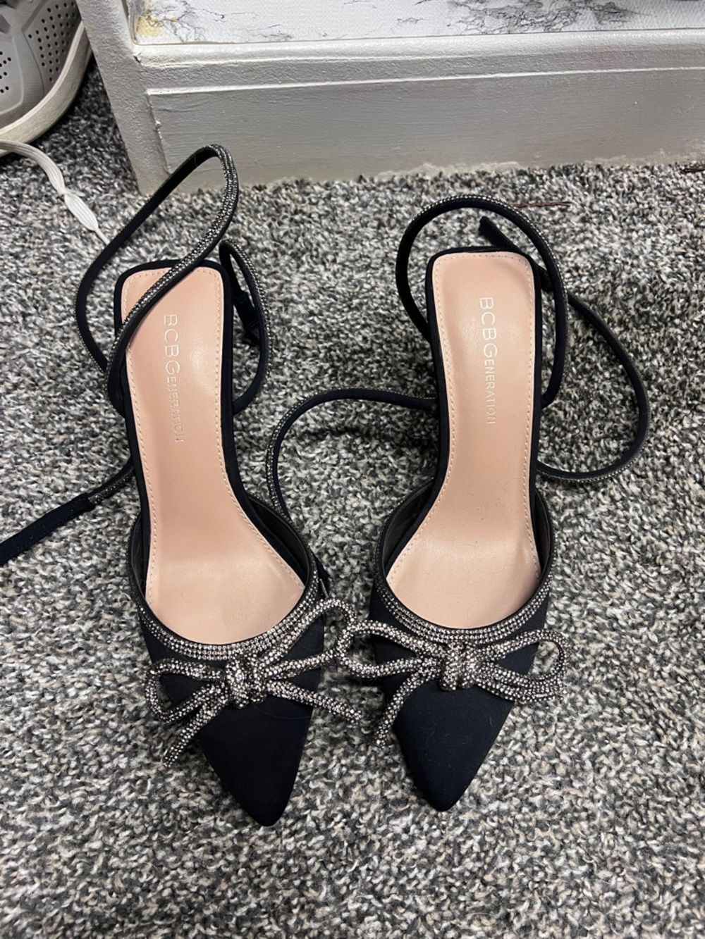 BCBG Black Pointed-Toe Strappy Heels with Rhinestone Bow